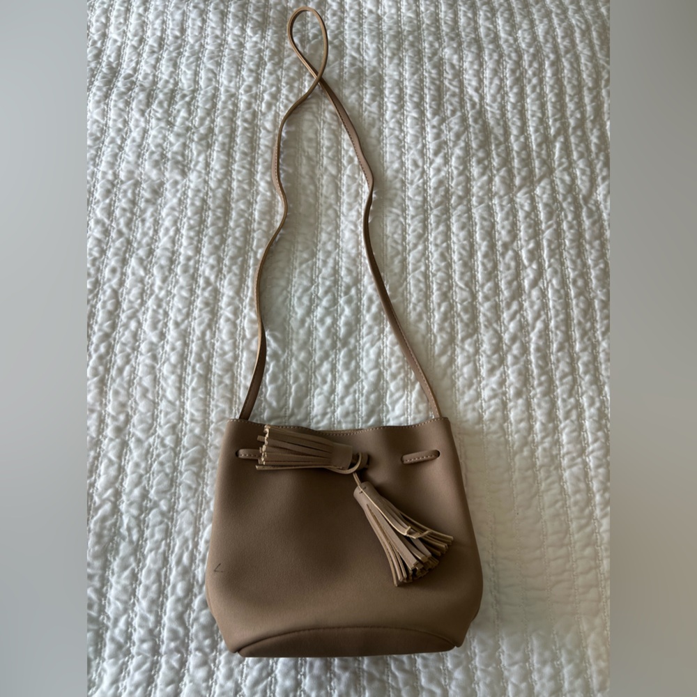 Taupe bucket bag, small pen mark (pictured), otherwise in great condition